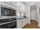 Modern kitchen with stainless steel appliances and white cabinets at 131 English Violet Ln, Raleigh, NC 27610