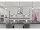 Spacious kitchen with a large island, modern appliances, and sleek countertops at 131 English Violet Ln, Raleigh, NC 27610