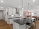 Well-equipped kitchen with large island, bar seating, and stainless steel appliances at 131 English Violet Ln, Raleigh, NC 27610
