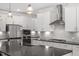 Modern kitchen featuring sleek countertops, stainless steel appliances, and an island at 131 English Violet Ln, Raleigh, NC 27610
