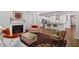 Open concept living room connected to the kitchen, featuring a fireplace at 131 English Violet Ln, Raleigh, NC 27610