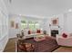 Comfortable living room with fireplace and views of the landscaped outdoor area at 131 English Violet Ln, Raleigh, NC 27610