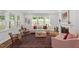 Cozy living room filled with natural light, fireplace, and comfortable seating at 131 English Violet Ln, Raleigh, NC 27610