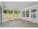 Relaxing screened porch with view of a lush backyard at 131 English Violet Ln, Raleigh, NC 27610