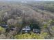 Beautiful aerial view of a home with a large backyard, pool, and mature trees at 1401 Granada Dr, Raleigh, NC 27612