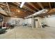 Unfinished basement with exposed ceiling and concrete flooring offers great storage potential at 1401 Granada Dr, Raleigh, NC 27612
