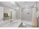 Modern bathroom featuring sleek vanity, tiled walls, and updated fixtures at 1401 Granada Dr, Raleigh, NC 27612