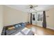 Cozy bedroom with hardwood floors, ceiling fan, and natural light, perfect for a relaxing retreat at 1401 Granada Dr, Raleigh, NC 27612