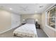 Cozy bedroom with carpet, ceiling fan, and window views at 1401 Granada Dr, Raleigh, NC 27612