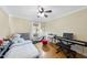 Comfortable bedroom with hardwood floors and natural light, perfect for relaxation and sleep at 1401 Granada Dr, Raleigh, NC 27612