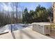 Backyard pool and jacuzzi surrounded by lush trees offering a private outdoor retreat at 1401 Granada Dr, Raleigh, NC 27612