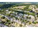 Aerial view of houses surrounded by trees and grassy areas at 148 Danesway Dr, Holly Springs, NC 27540