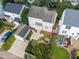 Overhead view reveals the spacious backyard with deck, patio, and detached garage at 148 Danesway Dr, Holly Springs, NC 27540