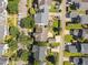 This aerial shot reveals the property's backyard deck and mature trees at 148 Danesway Dr, Holly Springs, NC 27540
