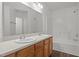 Bathroom featuring a double vanity and a shower-tub combination at 148 Danesway Dr, Holly Springs, NC 27540