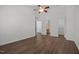 Bedroom with wood-look flooring and easy access to both the bathroom and walk-in closet at 148 Danesway Dr, Holly Springs, NC 27540