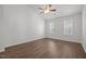 Bedroom with two windows and a ceiling fan providing ample natural light and air circulation at 148 Danesway Dr, Holly Springs, NC 27540
