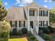 Beautiful two-story home with a traditional design, well-manicured shrubs, and a cozy entrance at 148 Danesway Dr, Holly Springs, NC 27540