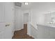 Hallway showing the staircase, storage closet and an archway leading to another room at 148 Danesway Dr, Holly Springs, NC 27540