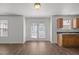 Kitchen area features wood cabinets, stainless sink, and door to backyard at 148 Danesway Dr, Holly Springs, NC 27540