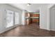 Open floorplan features a kitchen with wood cabinets, stainless appliances and dining area at 148 Danesway Dr, Holly Springs, NC 27540
