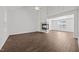 Spacious living room with a modern fireplace, high ceilings, wood floor and natural light at 148 Danesway Dr, Holly Springs, NC 27540