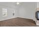 Bright living room with wood flooring, neutral walls, ceiling fan, and ample natural light at 148 Danesway Dr, Holly Springs, NC 27540