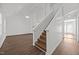 Spacious living room area featuring high ceilings, natural light, and sleek wood-look floors at 148 Danesway Dr, Holly Springs, NC 27540