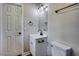 Bathroom featuring a modern vanity, sleek fixtures, and neutral decor at 1592 Boone Rd, Elon, NC 27244