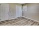 Neutral bedroom with hardwood floors, closet and natural light at 1592 Boone Rd, Elon, NC 27244