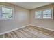 Bedroom filled with natural light and featuring wood-look flooring at 1592 Boone Rd, Elon, NC 27244