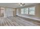 Spacious living area with modern flooring, offering ample natural light and comfortable living space at 1592 Boone Rd, Elon, NC 27244