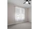 Bedroom featuring neutral carpet, a ceiling fan, and sheer curtains over the windows at 1662 Beechaven Rd, Fuquay Varina, NC 27526