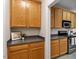 This kitchen also has a coffee bar area with wooden cabinets and dark countertops at 1662 Beechaven Rd, Fuquay Varina, NC 27526