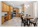 Bright kitchen with stainless steel appliances, tile floors, and a breakfast nook at 1662 Beechaven Rd, Fuquay Varina, NC 27526