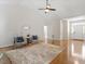 Spacious living room with hardwood floors, neutral walls, and ample natural light at 1662 Beechaven Rd, Fuquay Varina, NC 27526
