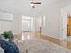 Living room featuring hardwood floors and a view of dining and kitchen areas at 1662 Beechaven Rd, Fuquay Varina, NC 27526