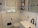 Bright bathroom featuring modern fixtures, white shiplap walls, and a clean, updated vanity area at 1700 Warrenton Rd, Henderson, NC 27537