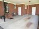 Spacious brick carport featuring covered parking and bench seating by the front door at 1700 Warrenton Rd, Henderson, NC 27537