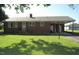 Charming brick ranch with a well maintained lawn and covered side entry at 1700 Warrenton Rd, Henderson, NC 27537
