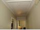Bright hallway with access to the attic blends functionality with classic design, leading to comfortable living spaces at 1700 Warrenton Rd, Henderson, NC 27537