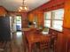 Cozy kitchen with wood cabinets, stainless steel fridge, and a breakfast nook at 1700 Warrenton Rd, Henderson, NC 27537