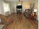 Spacious living room with hardwood floors, ceiling fan, and plenty of natural light at 1700 Warrenton Rd, Henderson, NC 27537