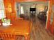 Open-concept space with hardwood floors, connecting the living room to the dining area at 1700 Warrenton Rd, Henderson, NC 27537