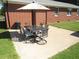 Outdoor patio with a patio table, chairs and umbrella for outdoor dining and relaxation at 1700 Warrenton Rd, Henderson, NC 27537