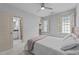 Bedroom with ensuite bathroom showcasing a calming retreat with natural light from shuttered windows at 1711 Happiness Hill Ln, Raleigh, NC 27614