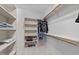 Walk-in closet with custom shelving, hanging rods, and carpet at 1711 Happiness Hill Ln, Raleigh, NC 27614