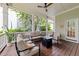Inviting covered patio with comfortable seating and a cozy fire pit at 1711 Happiness Hill Ln, Raleigh, NC 27614