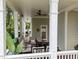 Outdoor covered patio features a seating area with comfortable furniture and a grill at 1711 Happiness Hill Ln, Raleigh, NC 27614