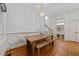 Cozy dining area with a wooden table, bench seating, and elegant wall trim at 1711 Happiness Hill Ln, Raleigh, NC 27614